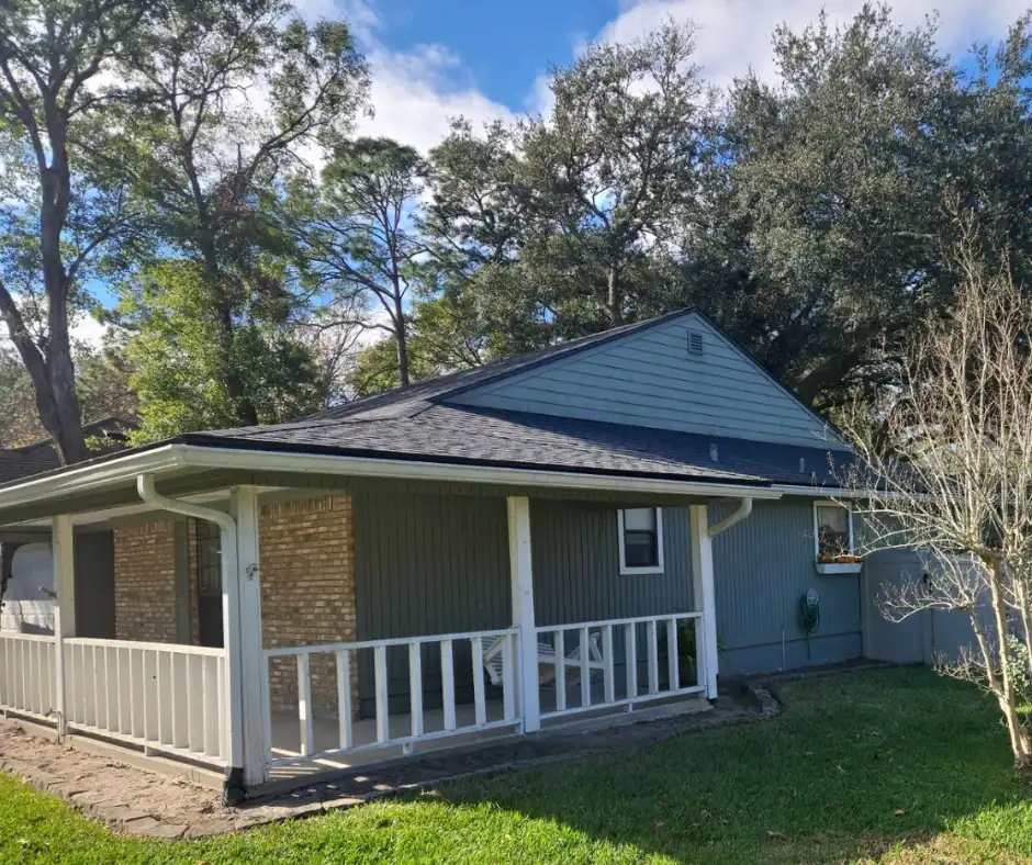Full wide shot, blue-gray ranch home, complete new roof